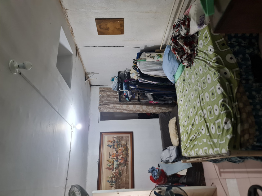 Vacant lot with old house for sale near gate 1 of Merville Park, Paranaque City